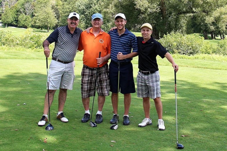a group of men standing next to each other on a green field, by Scott M. Fischer, flickr, wearing golf shorts, smiling for the camera, frank frazzeta, taking control while smiling
