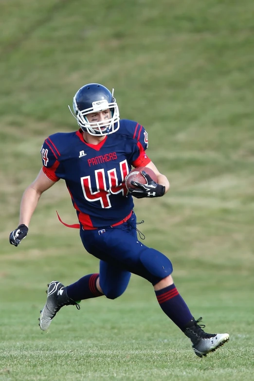 a man running with a football on a field, by Wayne England, shutterstock, patriot, full face shot, high school, navy