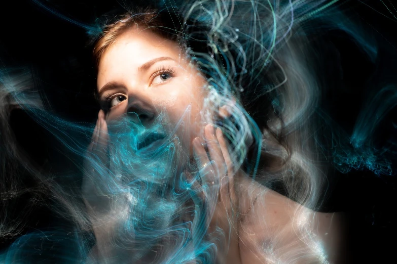 a woman with blue smoke coming out of her face, digital art, shutterstock, digital art, portrait of alexandra daddario, swirling bioluminescent energy, aura jared and wires, transparent celestial light gels