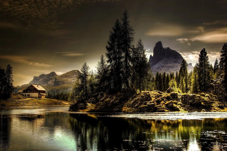 a large body of water surrounded by trees, a matte painting, romanticism, dolomites, hdr photography, beautiful random images, dark