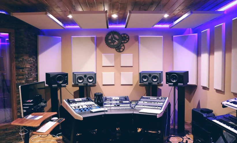 a room filled with lots of electronic equipment, purple accent lighting, 🎨🖌️, studio quality product, subwoofer