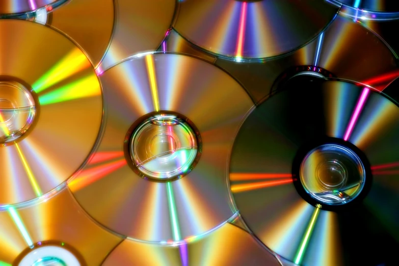 a pile of cds sitting on top of each other, a screenshot, by Dan Content, high detailed light refraction, great light and shadows”, computer game, mid shot photo