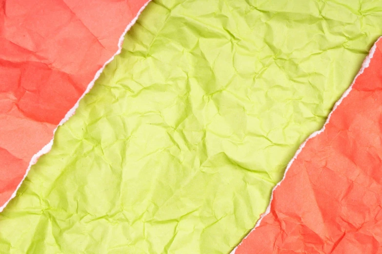 a couple of pieces of paper sitting on top of each other, color field, closeup photo, green bright red, paper crumpled texture, istockphoto