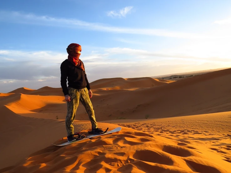 a man standing on top of a snowboard in the desert, a picture, shutterstock, moroccan city, beautiful lady, usa-sep 20, sandy