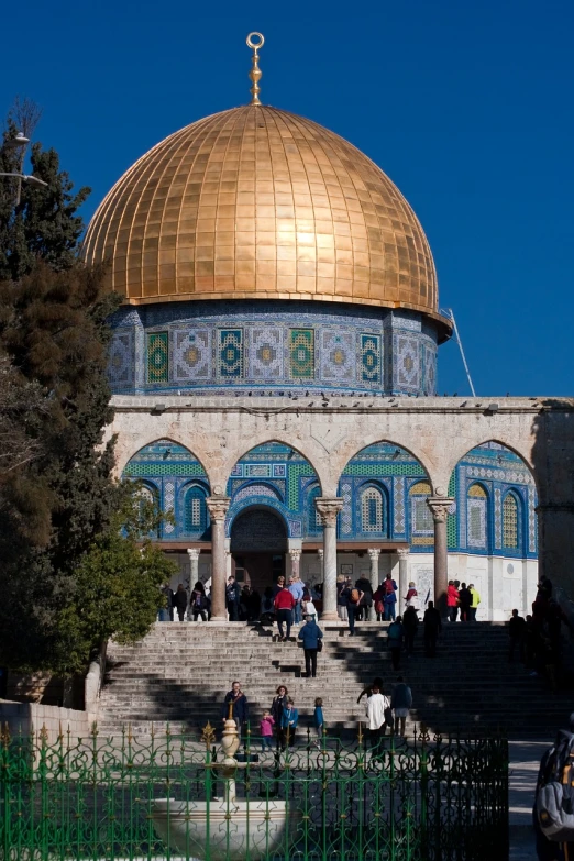 a group of people that are standing in front of a building, by Elias Goldberg, shutterstock, dome of the rock, 2 0 1 0 photo, temple of the sun, seen from outside