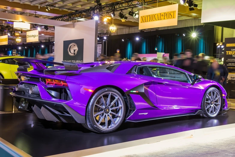 a purple sports car is on display in a showroom, by Anthony Devas, trending on pexels, panfuturism, veneno, toronto, raptor, colour corrected
