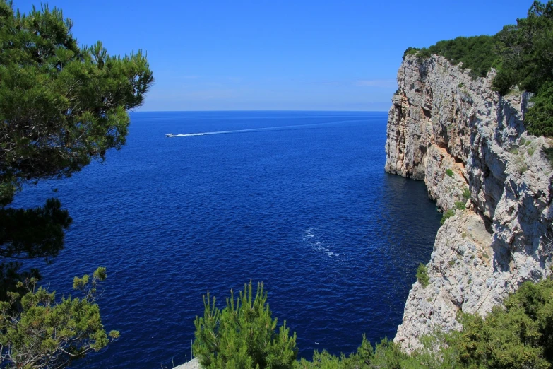 a large body of water next to a cliff, a picture, romanticism, croatian coastline, crossing the blue horizon, vacation photo