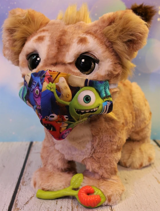 a close up of a stuffed animal on a table, toyism, dust mask, monsters inc, cat dog teddy mix, surgical mask covering mouth