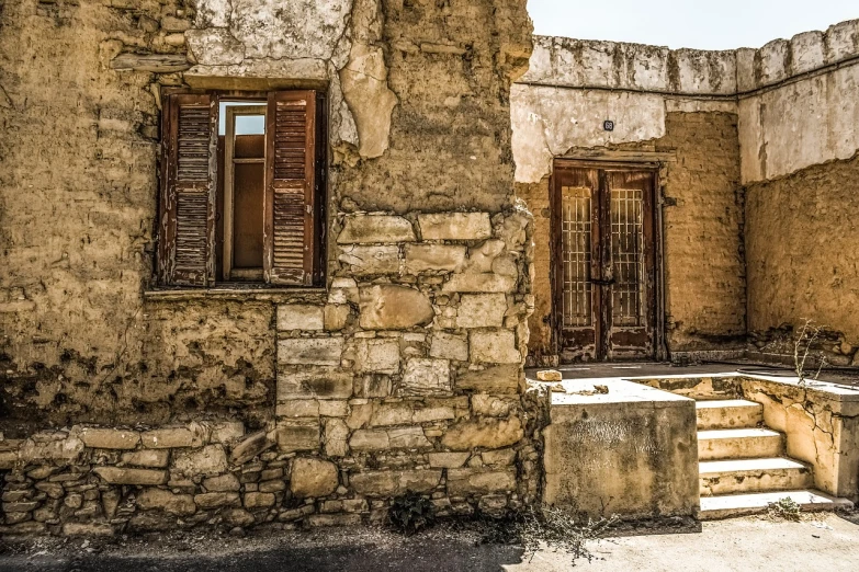 a very old building with a bunch of windows, a picture, by Michalis Oikonomou, cyprus, doors to various living quarters, ruined subdivision houses, background image