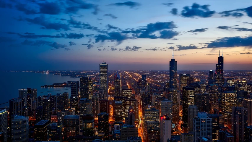 a view of a city at night from the top of a building, by Matthew D. Wilson, pexels, chicago skyline, beautiful and spectacular dusk, richly detailed, illinois