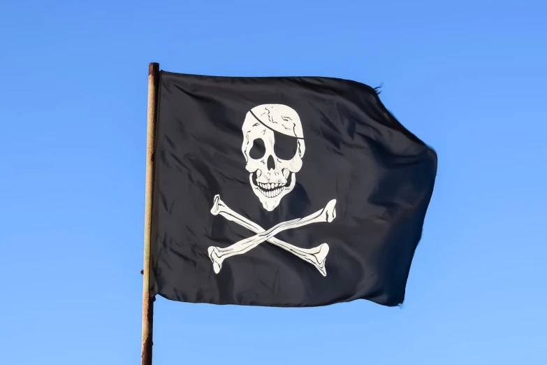 a pirate flag with a skull and crossbones on it, by John Murdoch, shutterstock, blue sky, close up high detailed, skeletons on a pirate ship, 3-dimensional