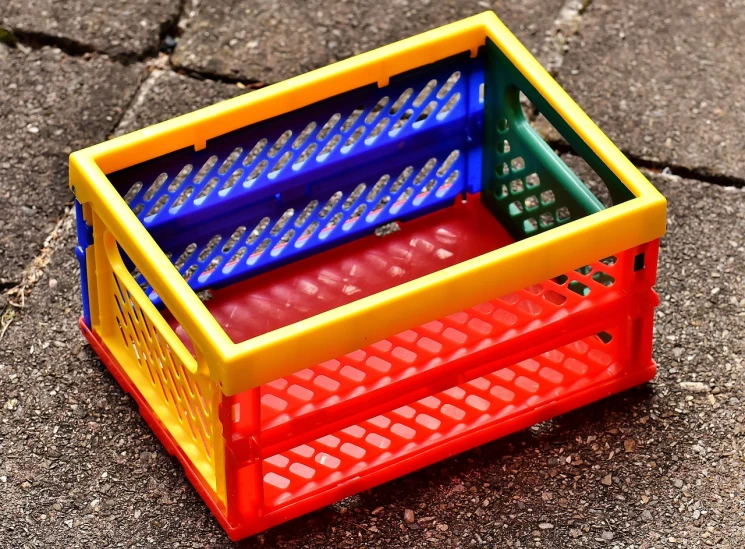 a colorful plastic crate sitting on the ground, a picture, pexels, bauhaus, folding - time, wonderful details, boixcar style, ebay product