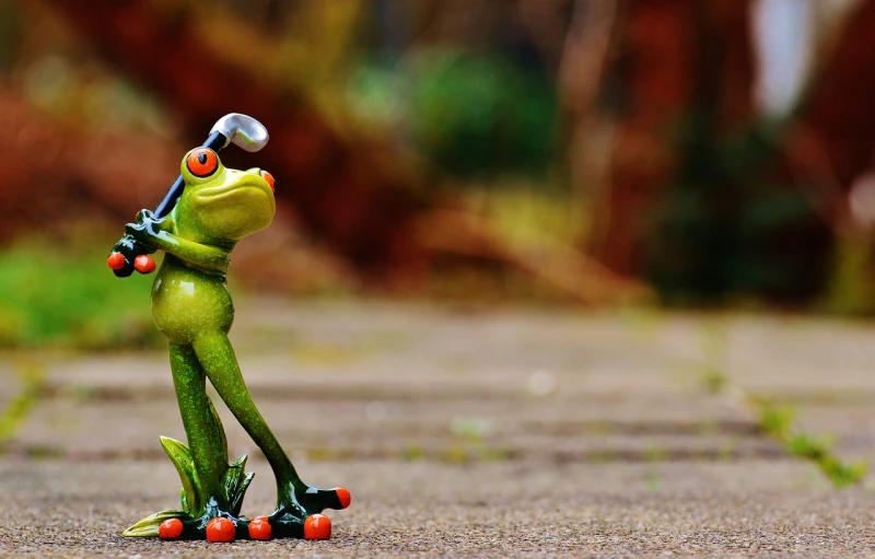 a figurine of a frog holding a baseball bat, by Jesper Knudsen, pixabay contest winner, standing bravely on the road, playful pose, hiking cane, kermit