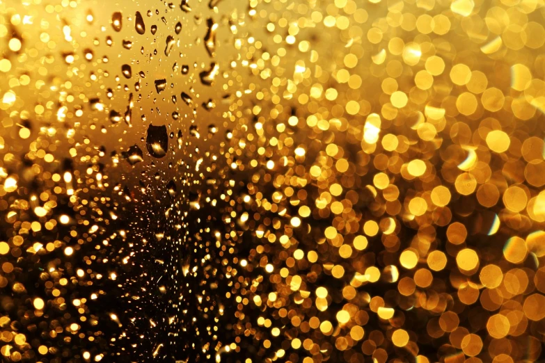 a close up of water droplets on a window, by Aleksander Gierymski, glowing gold embers, shiny skin”