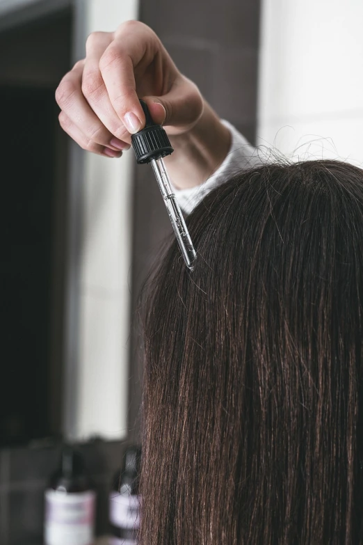 a woman getting her hair done by a hair stylist, by Adam Marczyński, shutterstock, hurufiyya, holding syringe, close-up shot from behind, girl with dark brown hair, texture