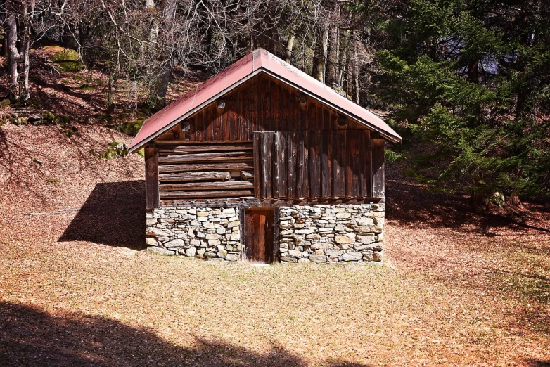 a small stone building sitting in the middle of a forest, a photo, inspired by Antonín Chittussi, shutterstock, folk art, log cabin beneath the alps, museum quality photo, stock photo