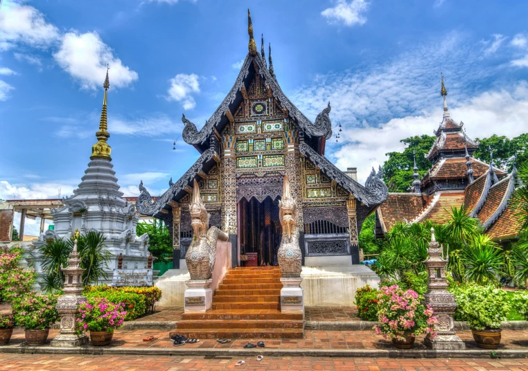 a building with a lot of flowers in front of it, a picture, by Reuben Tam, shutterstock, thai temple, bamboo, highly detailed hdr, silver