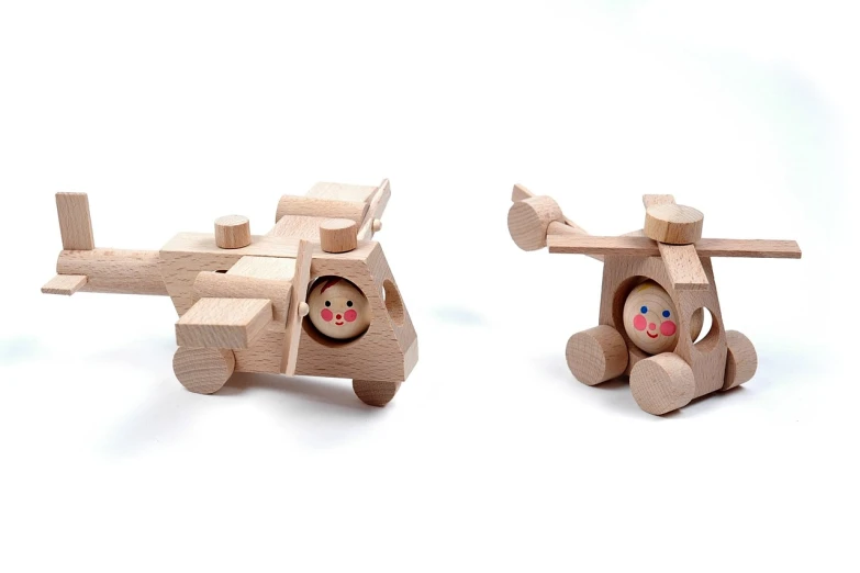 a couple of wooden toys sitting next to each other, by Aleksander Gierymski, figuration libre, air support, product photo, multiple details, correct faces