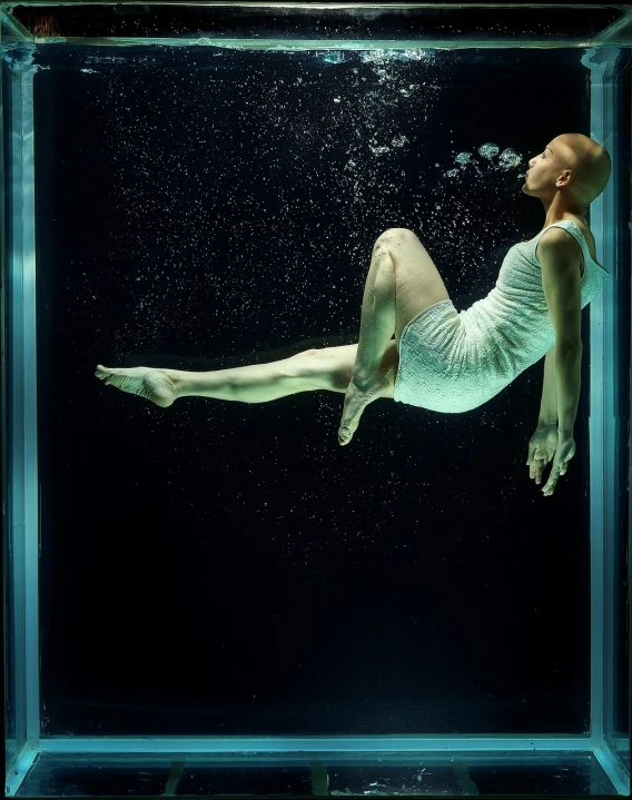 a woman floating in a glass box in the water, inspired by Maciej Kuciara, full length shot, uv, albino, molecular