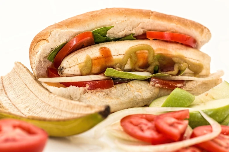 a sandwich sitting on top of a white plate, a photo, by Micha Klein, shutterstock, photorealism, subway, details and vivid colors, 1940s food photography, cut-away