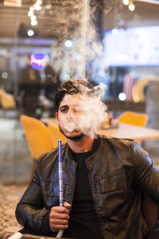 a man sitting at a table with a cigarette in his mouth, pexels, hurufiyya, smokey cannons, at a mall, arabian night, liquid smoke twisting