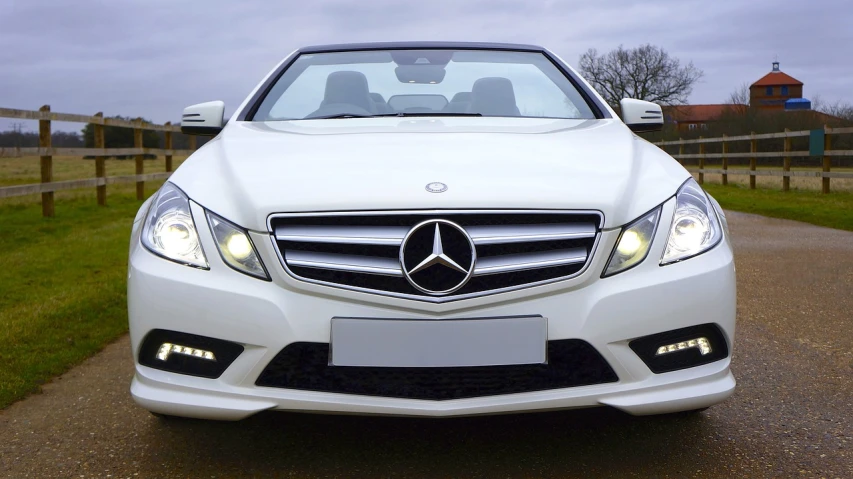 the front of a white mercedes benz benz benz benz benz benz benz benz benz benz benz benz, by Julian Allen, trending on pixabay, top down, award-winning”, ready to eat, eye-catching