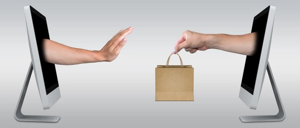 a person holding a shopping bag in front of a computer screen, a stock photo, pixabay, conceptual art, reaching out to each other, on a gray background, an antique, 2 people