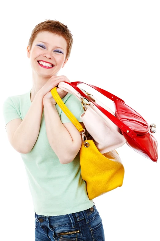 a woman holding a bunch of purses over her shoulder, by Juan O'Gorman, shutterstock, being delighted and cheerful, high key, red green yellow color scheme, at checkout