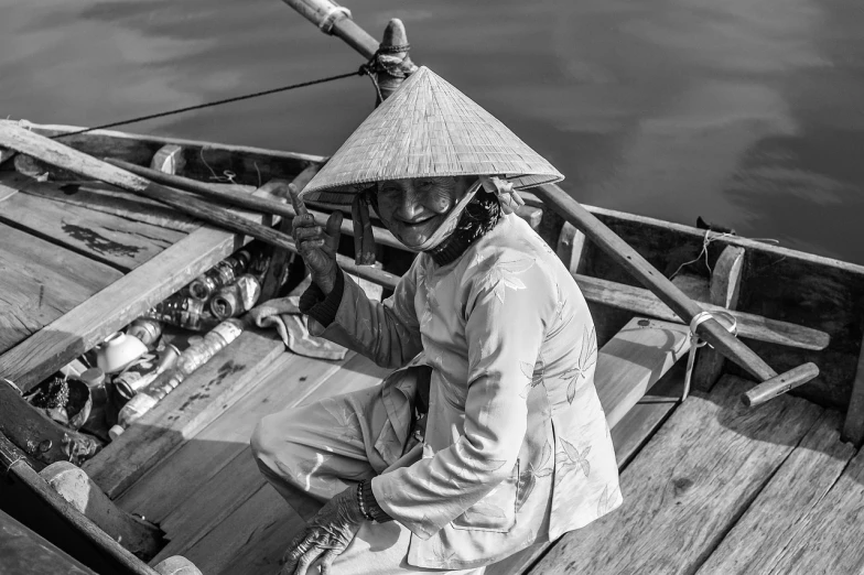 a black and white photo of a person in a boat, a portrait, by Sven Erixson, pixabay contest winner, vietnamese woman, pointy conical hat, very very happy!, highly detailed!