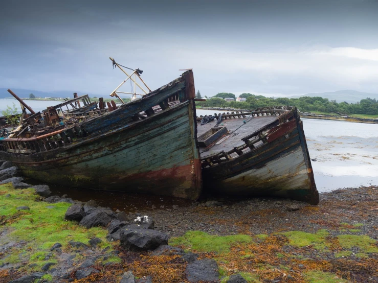 a couple of boats sitting on top of a beach, a portrait, by Richard Carline, shutterstock, tarnished and rusted metal, skye meaker, during a storm, front side view