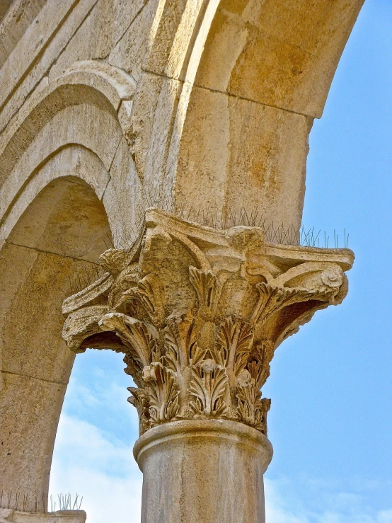 a close up of a column with a clock on it, by Ludovit Fulla, flickr, romanesque, conversano, sweeping arches, detail structure, floro details