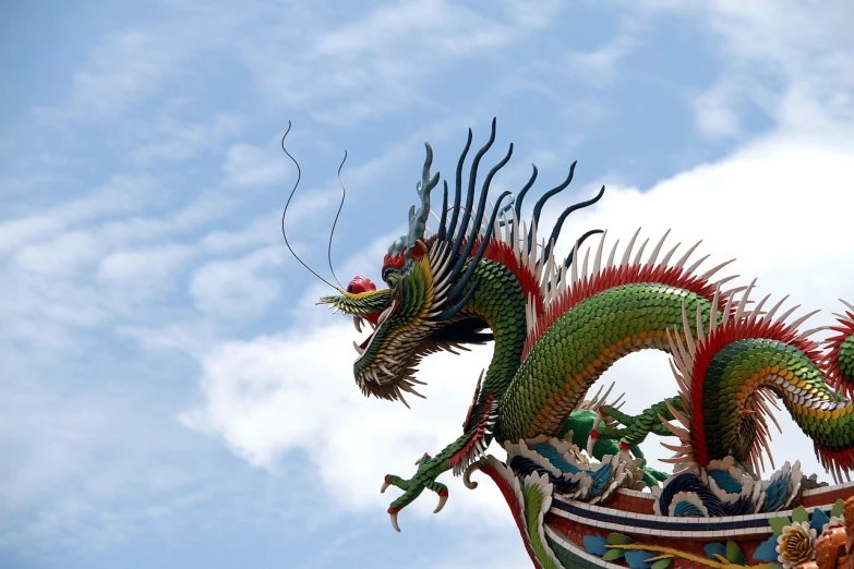 a dragon statue on top of a building, a picture, by Li Kan, flickr, cloisonnism, large green dragon, dragon flying in the sky, malaysian, china silk 3d dragon