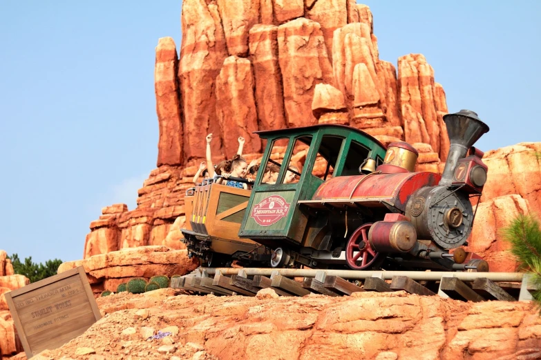 a train that is sitting on a track, concept art, by Tom Palin, shutterstock, disneyland as backdrop, moab, closeup!!!!!!, zoomed out shot