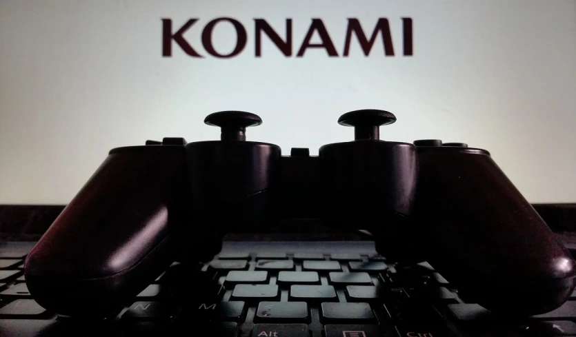 a close up of two video game controllers on a keyboard, a stock photo, by Nōami, ascii art, conan, title kanji, dominant, konami