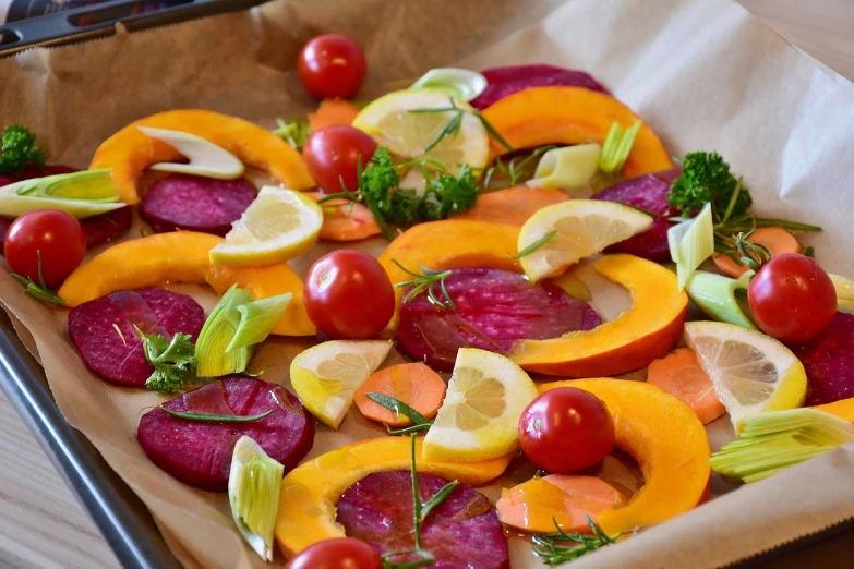 a tray of vegetables sitting on top of a table, by Maksimilijan Vanka, beets, oven, refreshing colour, high quality product image”