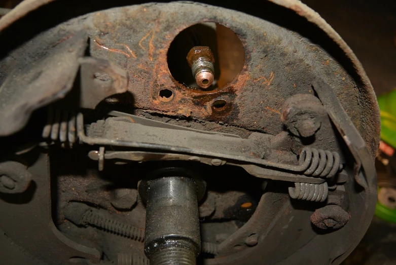 a close up of the front end of a vehicle, by Robert Brackman, flickr, many rusty joints, interior view, broken antenna, burn