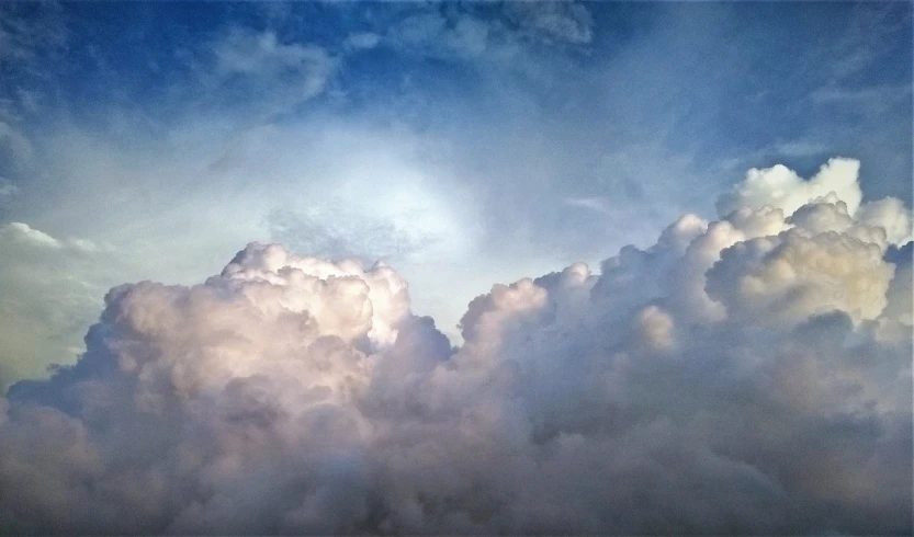 a plane flying through a cloud filled sky, by Jan Rustem, romanticism, major arcana sky, looking up onto the sky, video still, heavenly light