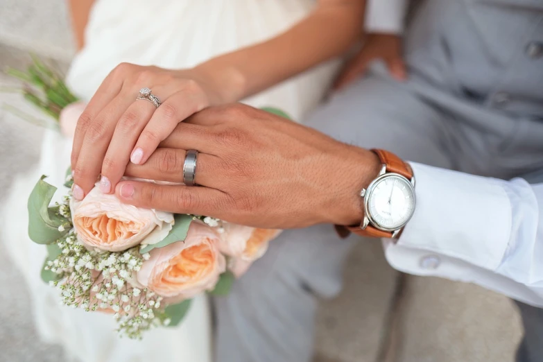 a close up of a bride and groom holding hands, 15081959 21121991 01012000 4k, wearing a watch, bouquet, 💣 💥