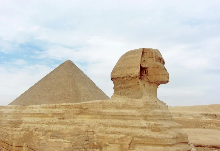 a statue of a sphinx in front of a pyramid, 2 0 1 0 photo, vacation photo, very beautiful photo, detailed zoom photo