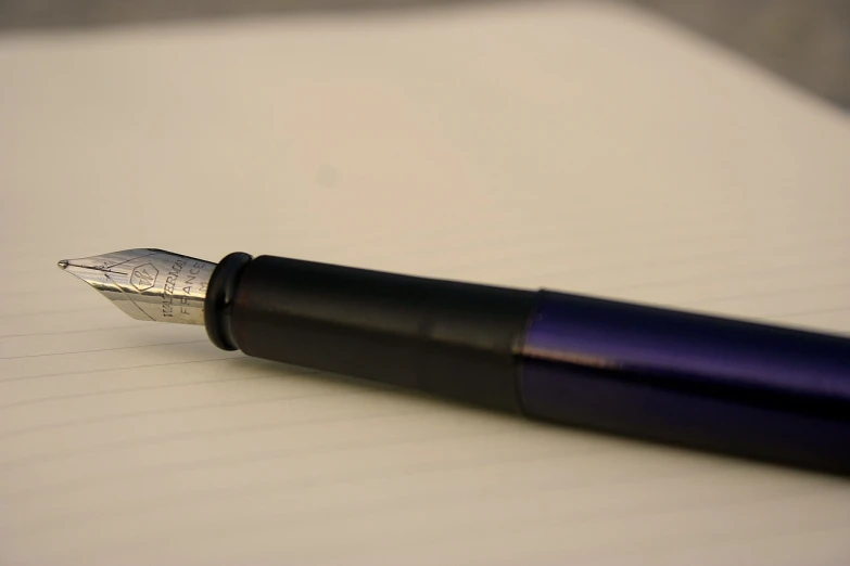 a fountain pen sitting on top of a piece of paper, by Thomas Häfner, some purple and blue, wikimedia, close - up profile, flikr