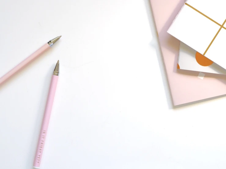 a pink pen sitting on top of a piece of paper, postminimalism, white and light-pink outfit, website banner, pencils, pink and gold