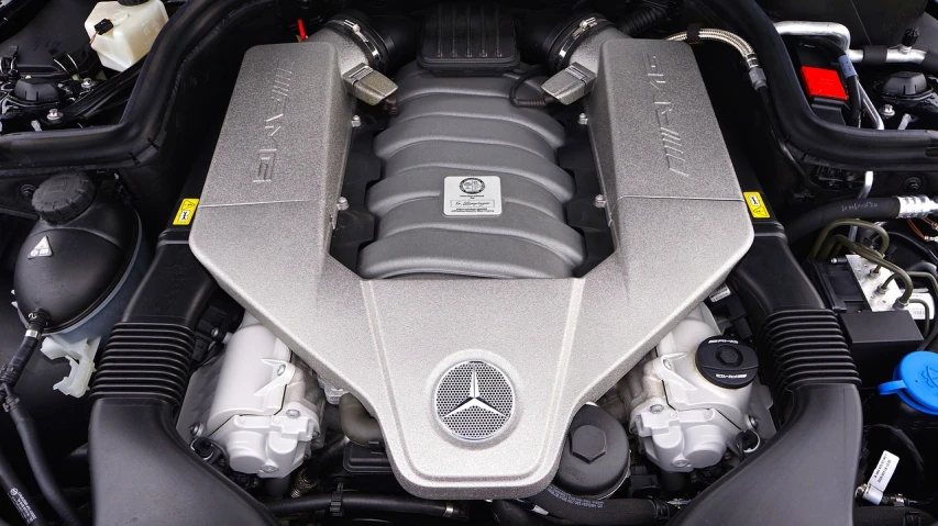 a close up of the engine of a car, mercedez benz, strong bespoke shape language, top - down view, full view of a car