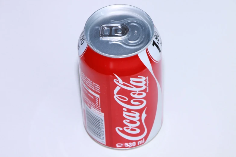 a can of coca cola on a white surface, a picture, from wikipedia, 3 0 0, product introduction photo, chile