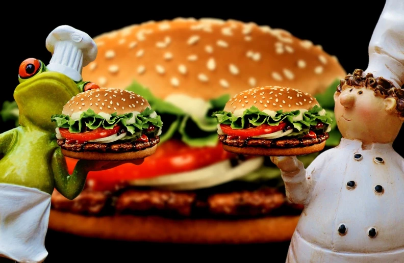 two figurines of a chef and a hamburger, a stock photo, by Julia Pishtar, shutterstock, fantastic realism, hq 4k phone wallpaper, serving big macs, on black background, two hovering twin nuns