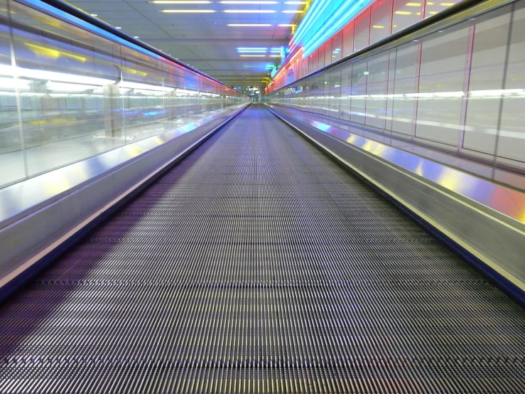 an empty escalator at an airport, flickr, futurism, leds, las vegas, shot on a 2 0 0 3 camera, bowling alley carpet