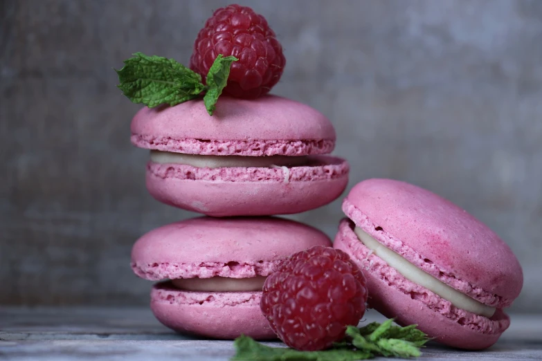 raspberry macarons stacked on top of each other, a pastel, inspired by François Louis Thomas Francia, pixabay, food commercial 4 k, mint, jean-sebastien rossbach, closeup - view