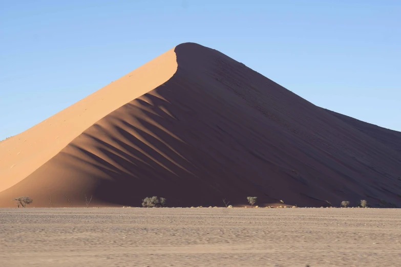 a large sand dune in the middle of a desert, a picture, by Richard Carline, les nabis, taken with canon 8 0 d, side view from afar, really large bosum, graafland