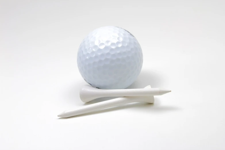 a golf ball and a tee on a white surface, by Robert Medley, dribble, 84mm), bone, educational, small horns