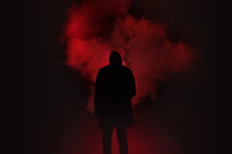 a person that is standing in the dark, conceptual art, red fog, backround dark, dark coat, hazer and light in dark