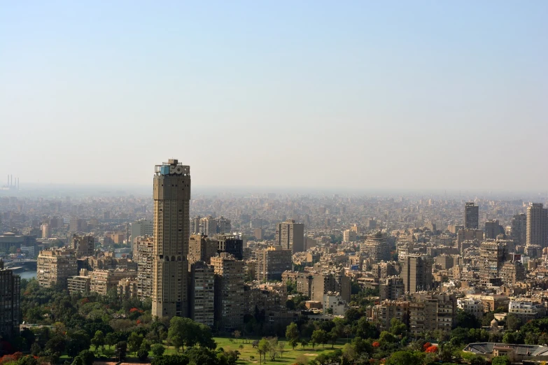 a view of a city from the top of a hill, by Bouchta El Hayani, shutterstock, cairo, taken with a pentax1000, tall building, stock photo